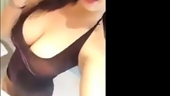 A Curvy Asian Woman Flaunts Her Ample Bosom